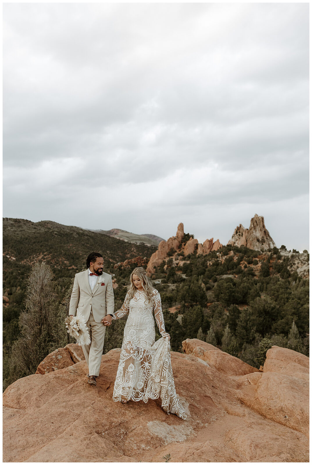 Garden of the Gods, Colorado boho micro wedding. Newlyweds. Interracial couple.